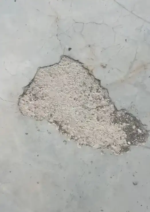 Concrete spalling and salt deposits from chronic water infiltration